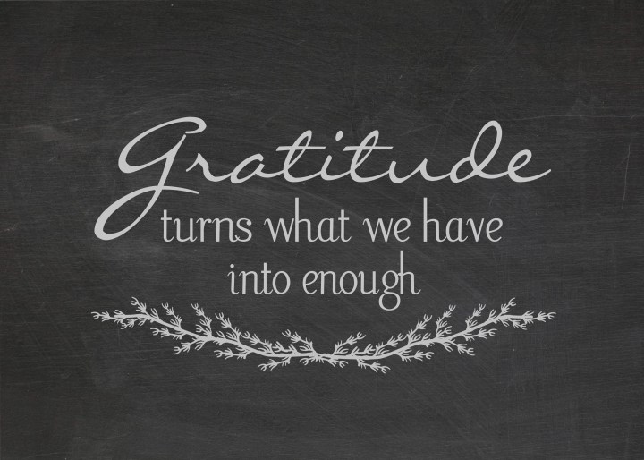 gratitude quote on dusty black chalkboard